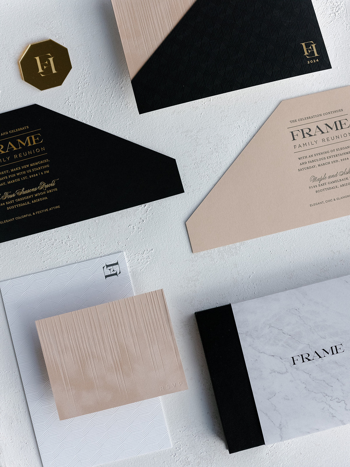 Collection of black, beige, and white stationery items with 'FRAME' branding on a light gray background.