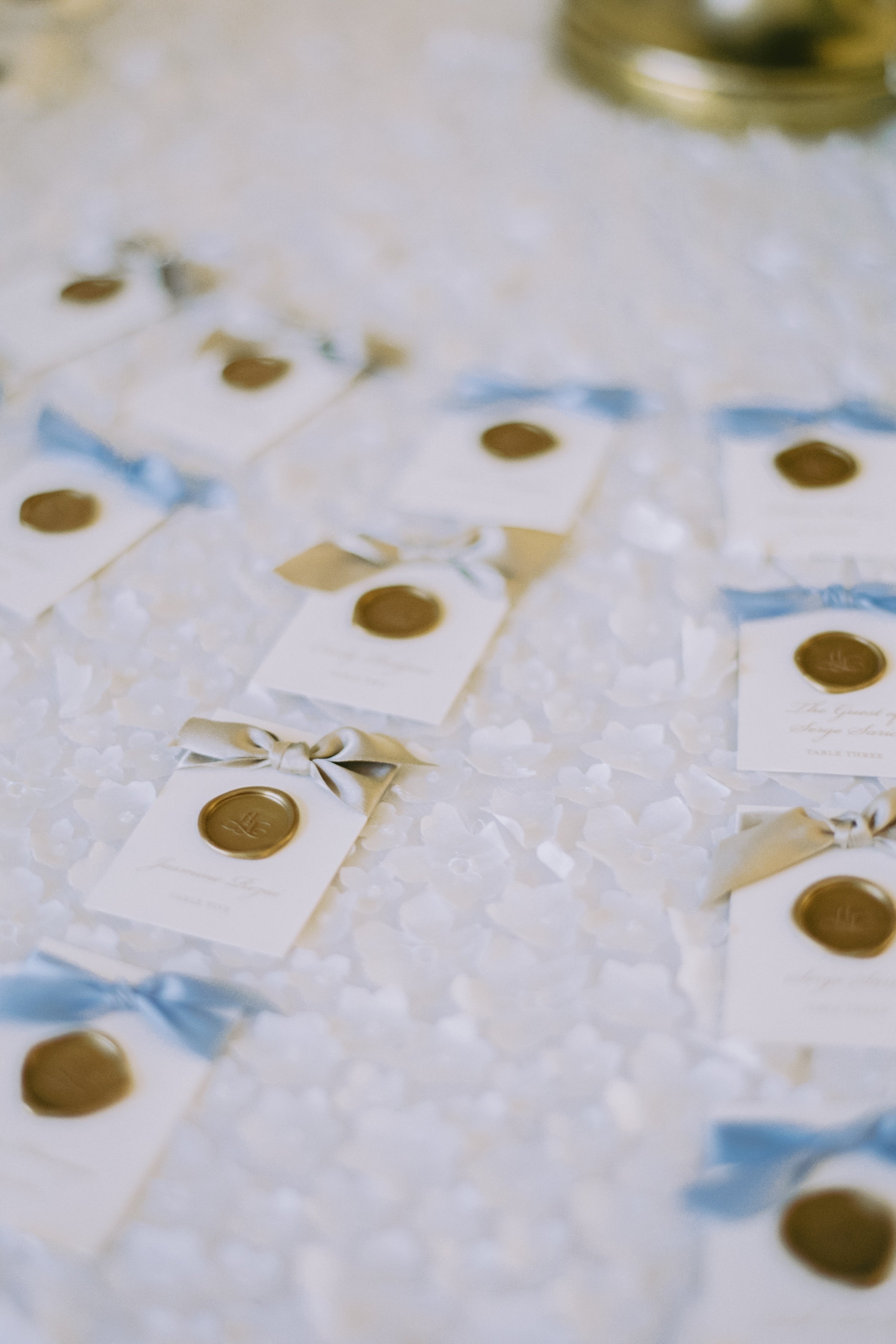 Close-up of decorative tiles with gold accents on a textured surface